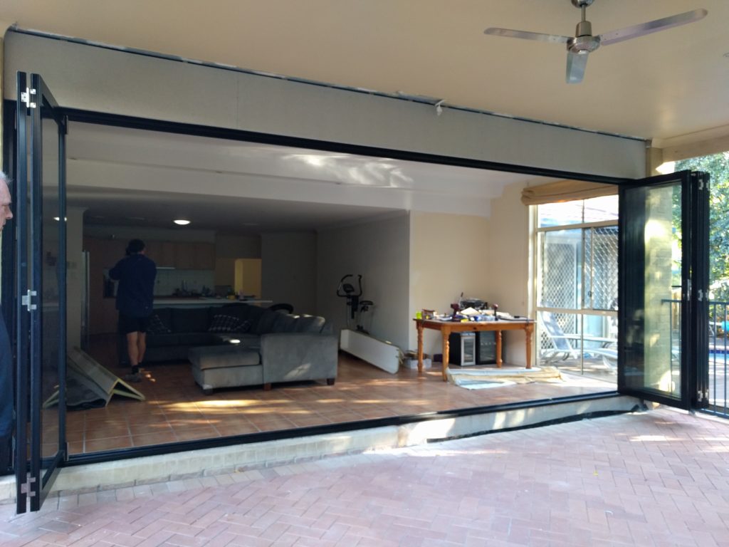 Chermside West after Photo of seven panel black aluminium bifold doors